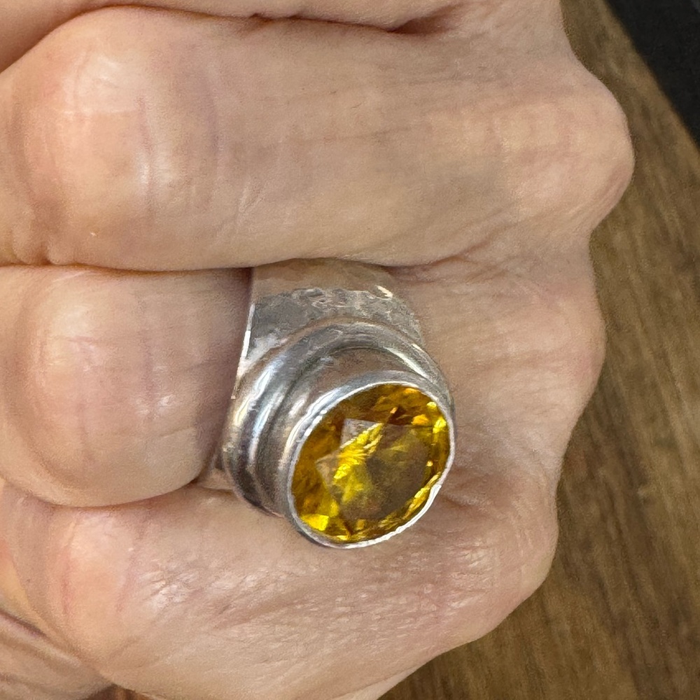 Radiant Silver Ring with Golden Yellow Gemstone